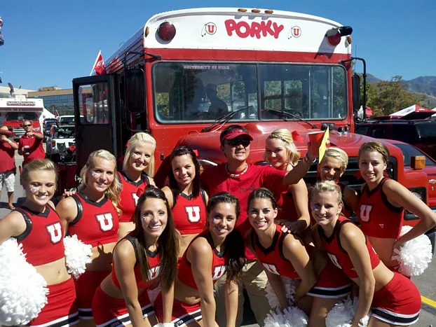 Cheerleaders and fans gathered at the front of the Pig Bus