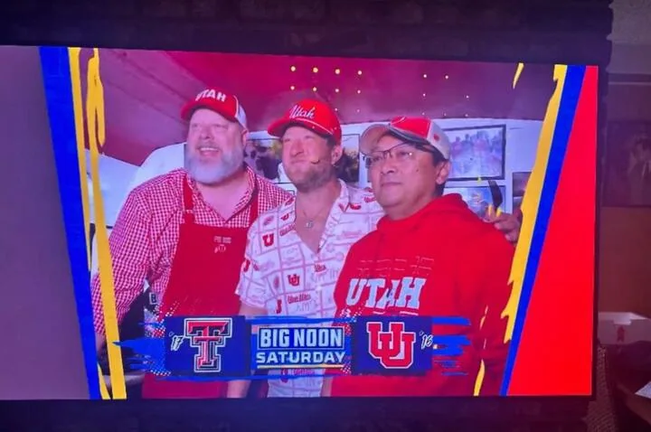 Television screen showing Pig Bus crew members during a FOX Big Noon Kickoff broadcast
