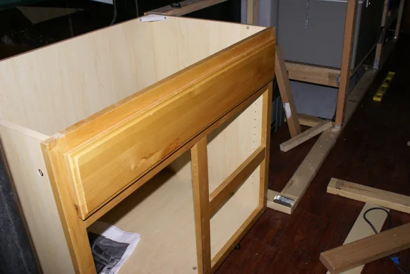 Wood cabinetry being built into the bus
