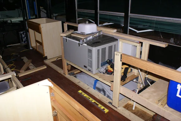 Galley framing inside the bus with the fridge, sink and cooler fitted