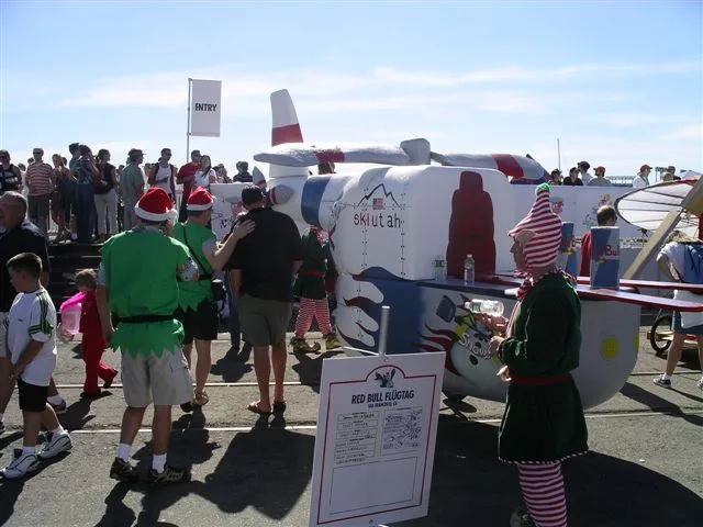 Elves and crowds around the flying machines on the pier at Red Bull Flugtag