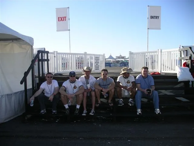 The team sitting on the steps of the Flugtag launch area by the bay