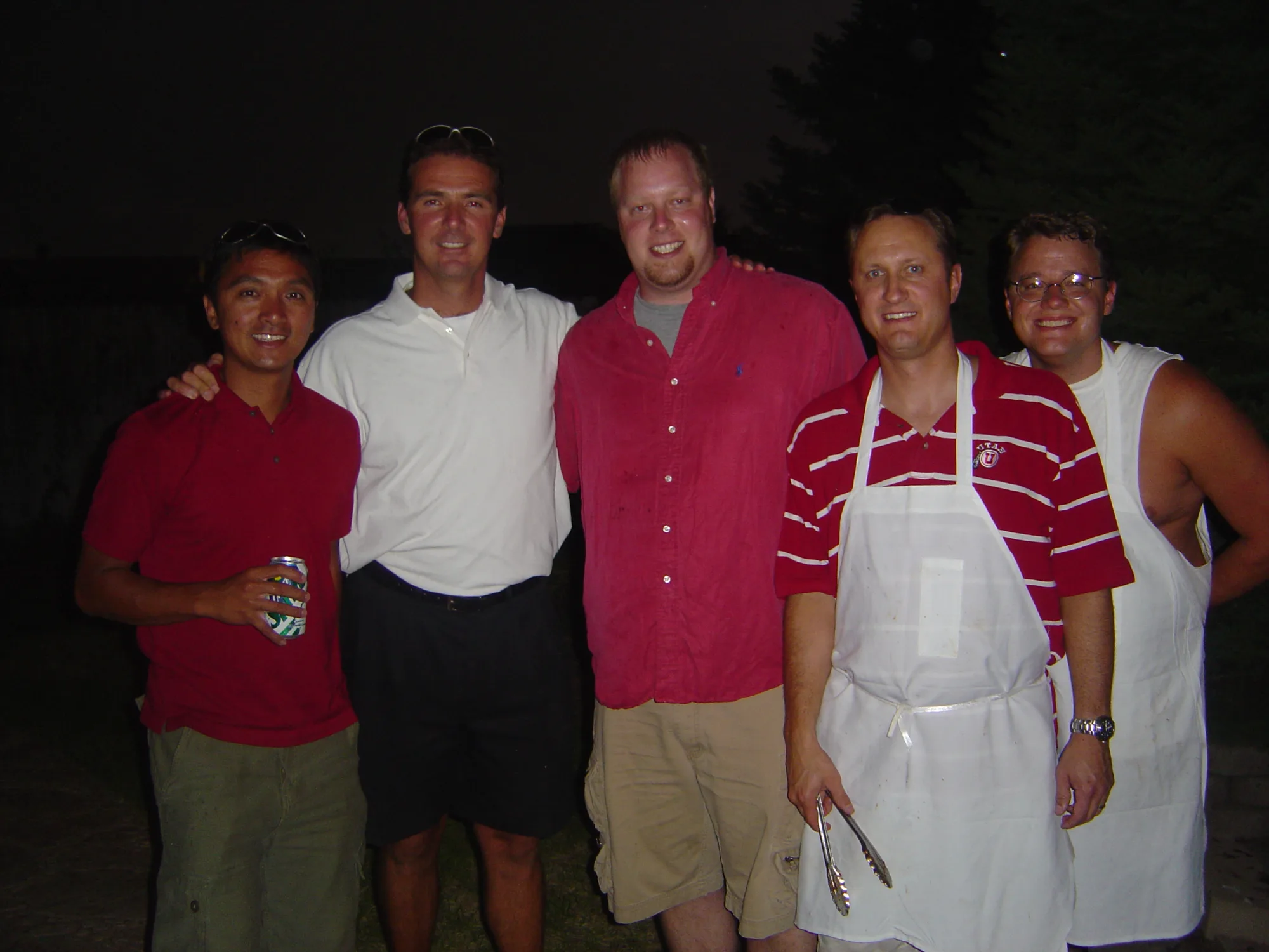 Five original crew members together at a night cookout