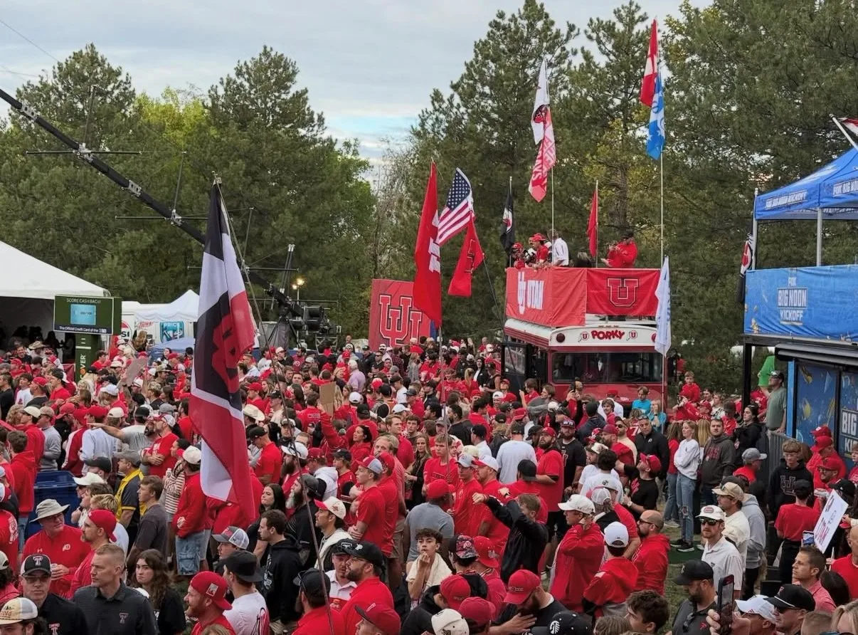 A sea of Utah red around Porky, flags flying, beside the Big Noon Kickoff set