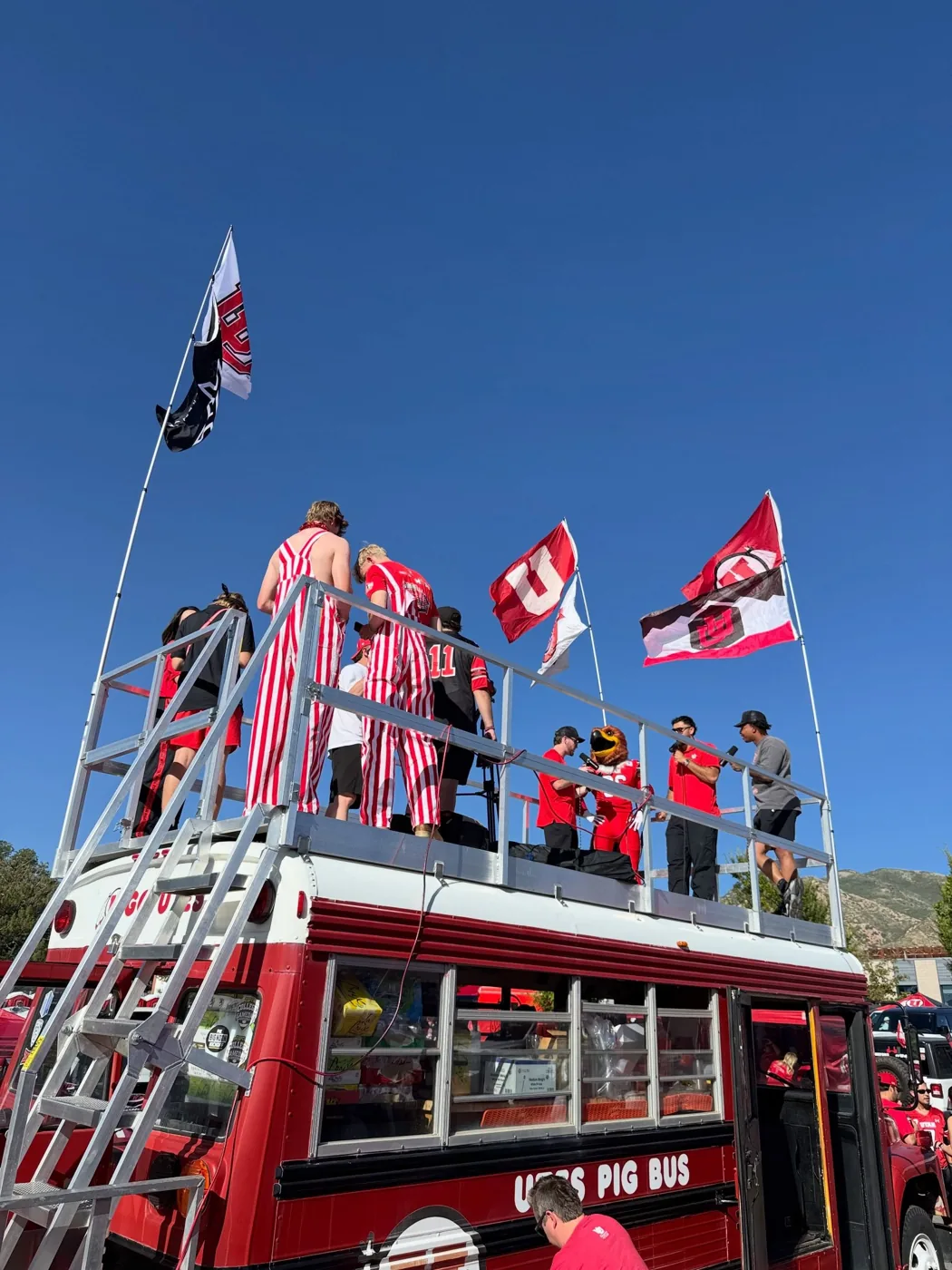 Swoop being interviewed on Porky’s roof deck under Utah flags