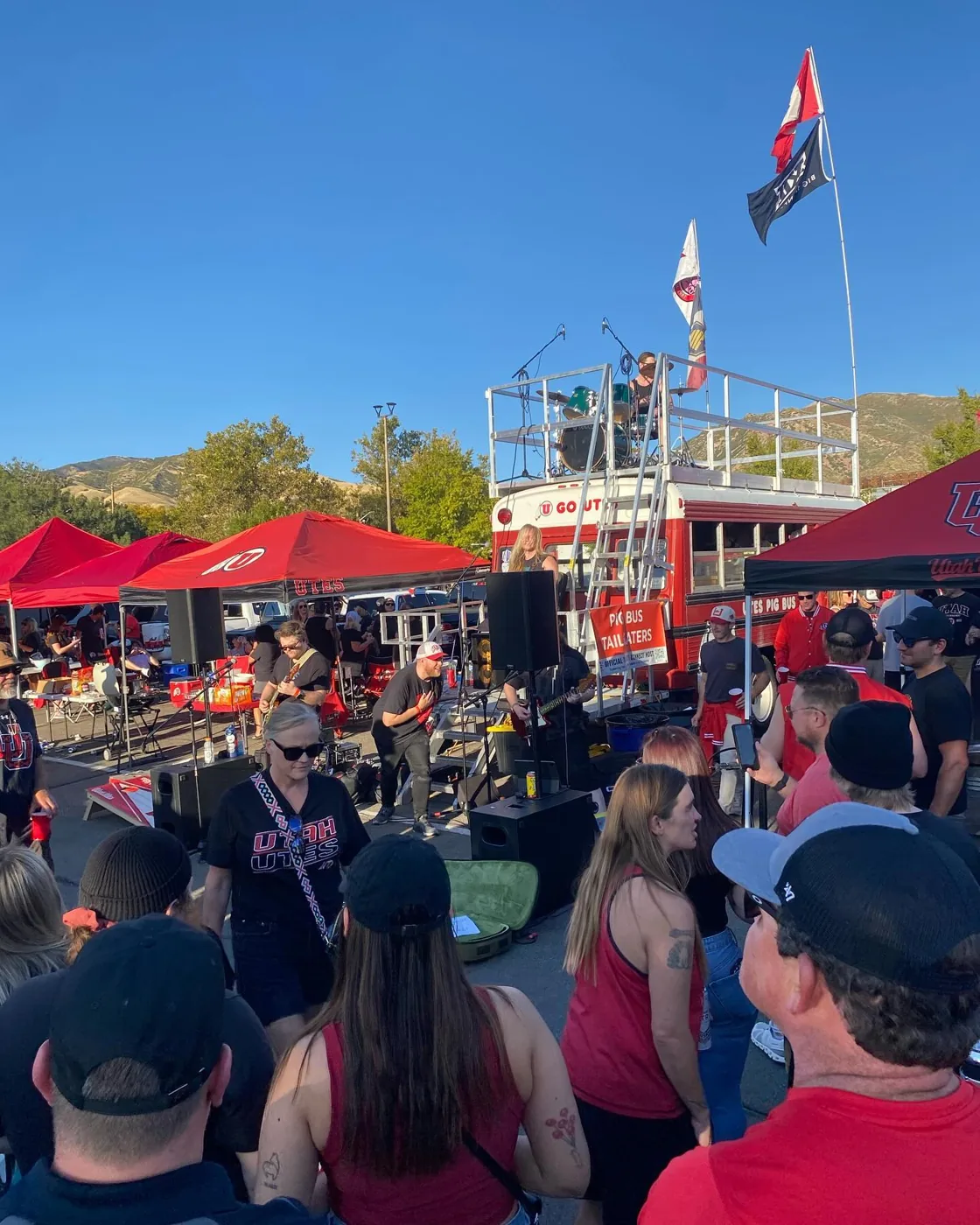 A rock band playing on and beside Porky’s roof deck to a crowd