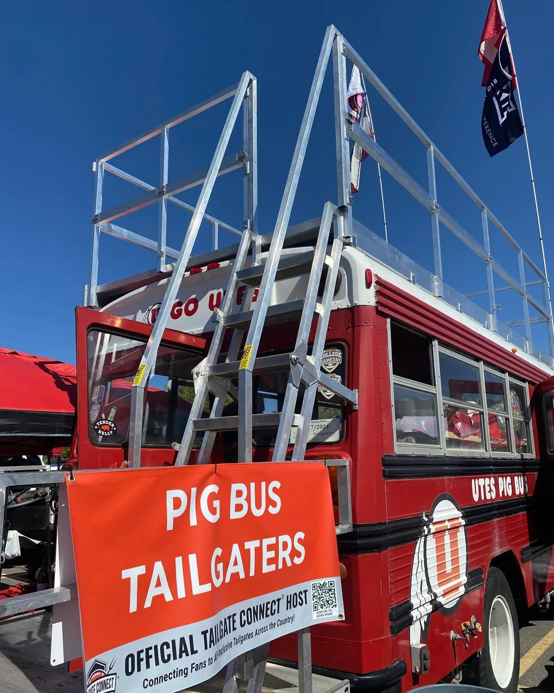 Porky with an orange PIG BUS TAILGATERS banner and the roof-deck stairs